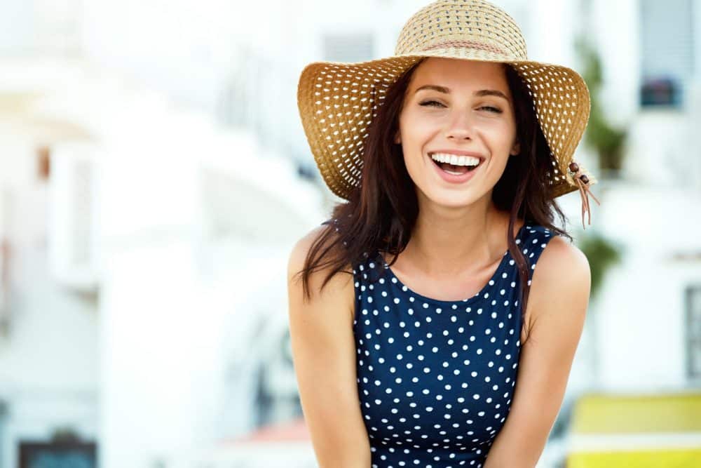 Portrait,Of,A,Beautiful,Woman,In,A,Straw,Hat.,Laughing smile makeover near me