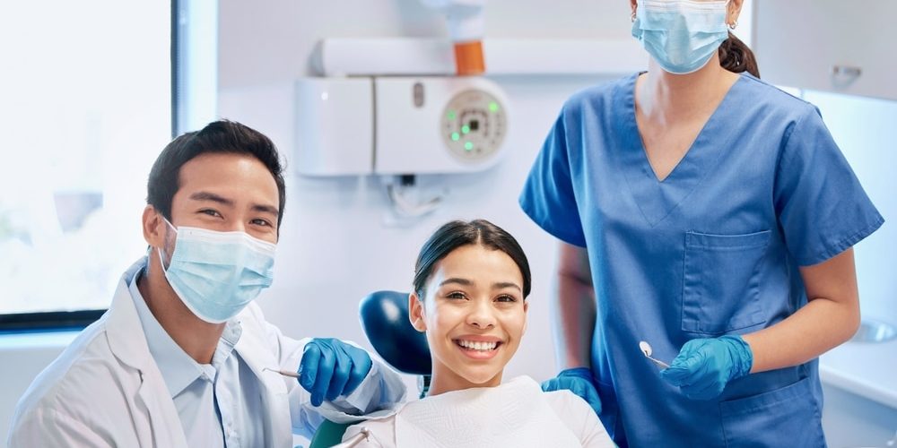 Portrait,Of,Dentist,And,Patient,In,Consultation,For,Teeth,Whitening, dental cleanings in chelsea